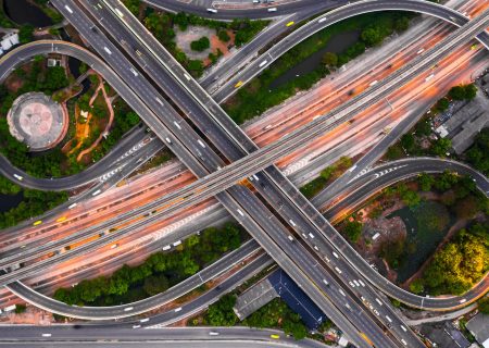 Aerial view elevated road and traffic junctions, Modern construction design traffic ways traffic jams, Road interchange or highway intersection with busy urban traffic Junction network of transportation.