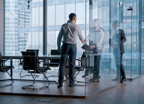office-concept-meeting-of-business-partners-in-a-conference-room-to-discuss-contracts-e1675384227999